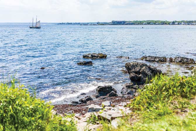 Cityscape or skyline of Kennebunkport town beach with ship and coast