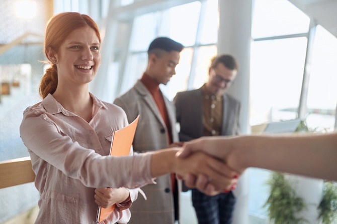 A young female employee has a business meeting at company. People, job, company, business concept.