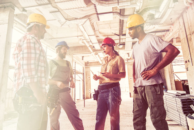 Group of construction workers having a discussion